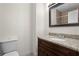 Modern bathroom featuring granite countertops and a dark wood vanity at 2531 Ludlow St, Deltona, FL 32738