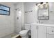 Updated bathroom with modern fixtures, including a tiled shower and vanity with sink at 2531 Ludlow St, Deltona, FL 32738