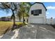 Charming home featuring white siding, an attached two-car garage, and a well-maintained front yard with mature trees at 2531 Ludlow St, Deltona, FL 32738