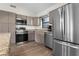 Modern kitchen features stainless steel appliances, granite countertops, and an open design at 2531 Ludlow St, Deltona, FL 32738
