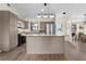 Bright and modern kitchen featuring an island, stainless steel appliances, and stylish hardwood floors at 2531 Ludlow St, Deltona, FL 32738