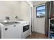 Bright laundry room with modern washer and dryer, plus a window for natural light at 2531 Ludlow St, Deltona, FL 32738