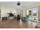 Bright living room with hardwood floors and large windows overlooking the pool area at 2531 Ludlow St, Deltona, FL 32738