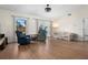 Spacious living room with hardwood floors and ample natural light from large windows and glass doors at 2531 Ludlow St, Deltona, FL 32738