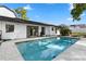 Backyard pool and patio area with solar panels on roof at 2531 Ludlow St, Deltona, FL 32738
