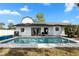 Backyard pool and patio area with solar panels on roof at 2531 Ludlow St, Deltona, FL 32738