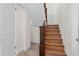 View of a classic wooden staircase featuring decorative trim and tiled landing at 2531 Ludlow St, Deltona, FL 32738