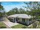 Overhead view of the property with a brick patio and verdant foliage at 265 W Constance Rd, Debary, FL 32713