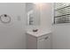 Bathroom with single sink vanity and mirror at 265 W Constance Rd, Debary, FL 32713