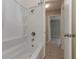Bathroom with tub shower combo and tile flooring at 265 W Constance Rd, Debary, FL 32713