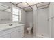 Bright bathroom features a shower and vanity with white fixtures at 265 W Constance Rd, Debary, FL 32713