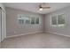 Bedroom featuring tile floors, a ceiling fan, and natural light at 265 W Constance Rd, Debary, FL 32713