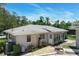 This home features a quaint brick patio and easy access to the sunroom at 265 W Constance Rd, Debary, FL 32713