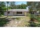 A charming single story house with a gray exterior, front yard and walkway to the door at 265 W Constance Rd, Debary, FL 32713