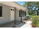 Charming single-story home with a well-manicured front yard, walkway and a gray exterior at 265 W Constance Rd, Debary, FL 32713
