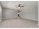 Open living room with tile flooring, a ceiling fan and view into other rooms at 265 W Constance Rd, Debary, FL 32713