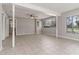 Spacious living room featuring tile floors, ceiling fan, and natural light at 265 W Constance Rd, Debary, FL 32713