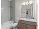 Contemporary bathroom featuring modern fixtures, a vanity with granite counters, and tiled shower at 2650 Howard Ave, Oviedo, FL 32765