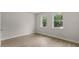 Bright bedroom with hardwood floors, recessed lighting, and generous natural light at 2650 Howard Ave, Oviedo, FL 32765