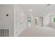 Bright bonus room featuring neutral walls, soft carpet, double door closet, and several entryways at 2650 Howard Ave, Oviedo, FL 32765