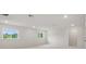 Bonus room featuring neutral walls, plush carpet, recessed lights, and views of trees through windows at 2650 Howard Ave, Oviedo, FL 32765