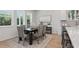 Dining room features a dark wood table, seating for six, and bright natural light at 2650 Howard Ave, Oviedo, FL 32765