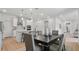 The dining area includes stylish lighting, modern decor, and open kitchen access at 2650 Howard Ave, Oviedo, FL 32765