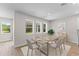 Cozy dining room with hardwood floors, recessed lighting, and views of the outdoors at 2650 Howard Ave, Oviedo, FL 32765