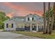 Beautiful two-story home featuring stone accents, a modern design, and manicured landscaping at 2650 Howard Ave, Oviedo, FL 32765