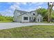 Charming home featuring a large driveway, two-car garage and manicured front lawn at 2650 Howard Ave, Oviedo, FL 32765