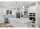 Beautiful kitchen with stainless steel appliances, a large island, and modern pendant lighting at 2650 Howard Ave, Oviedo, FL 32765