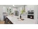 Bright kitchen with white cabinets, stainless appliances, large island, and stylish decor at 2650 Howard Ave, Oviedo, FL 32765