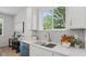 Close-up of kitchen sink and countertop showcasing the bright natural light at 2650 Howard Ave, Oviedo, FL 32765