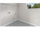Interior laundry room with simple shelving and modern gray tile flooring at 2650 Howard Ave, Oviedo, FL 32765