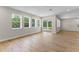 Bright living room with hardwood floors, recessed lighting, and sliding door access at 2650 Howard Ave, Oviedo, FL 32765