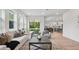 Open-concept living room with a large slider to the backyard and dining area views at 2650 Howard Ave, Oviedo, FL 32765