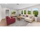 Bright living room with large windows, recessed lighting, and a contemporary aesthetic at 2650 Howard Ave, Oviedo, FL 32765