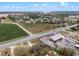 This aerial shows a large lot adjacent to highways and commercial buildings. and farmland at 29650 State Road 19, Tavares, FL 32778