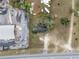 This aerial view captures the property's proximity to commercial services, highlighting lot size and tree coverage at 29650 State Road 19, Tavares, FL 32778