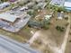 An overhead shot reveals the property, the adjacent commercial zone, and surrounding landscape features at 29650 State Road 19, Tavares, FL 32778