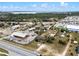 This aerial shows a large lot adjacent to highways and commercial buildings, utilities nearby at 29650 State Road 19, Tavares, FL 32778