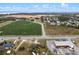This aerial shows a large lot adjacent to farms and highways with other commercial buildings at 29650 State Road 19, Tavares, FL 32778