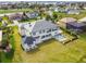 Spacious backyard with pool and patio, showcasing the home's expansive outdoor living space at 30215 Island Club Dr, Deer Island, FL 32778