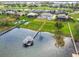 Waterfront property with private dock access to a serene lake and surrounding community at 30215 Island Club Dr, Deer Island, FL 32778