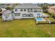Backyard with a pool, covered patio, well maintained yard and outdoor lounge area, perfect for entertaining at 30215 Island Club Dr, Deer Island, FL 32778