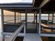 Picturesque boat house featuring screened enclosure offering relaxing views of the calm lake at 30215 Island Club Dr, Deer Island, FL 32778