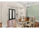 Dining room with chandelier, wainscotting, and stylish decor at 30215 Island Club Dr, Deer Island, FL 32778