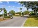 View of the community entrance, showcasing lush landscaping and an inviting gateway at 30215 Island Club Dr, Deer Island, FL 32778