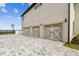 Spacious four-car garage with elegant exterior, offering ample parking at 30215 Island Club Dr, Deer Island, FL 32778