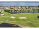 Golf course view, featuring a picturesque waterway with lush landscaping at 30215 Island Club Dr, Deer Island, FL 32778